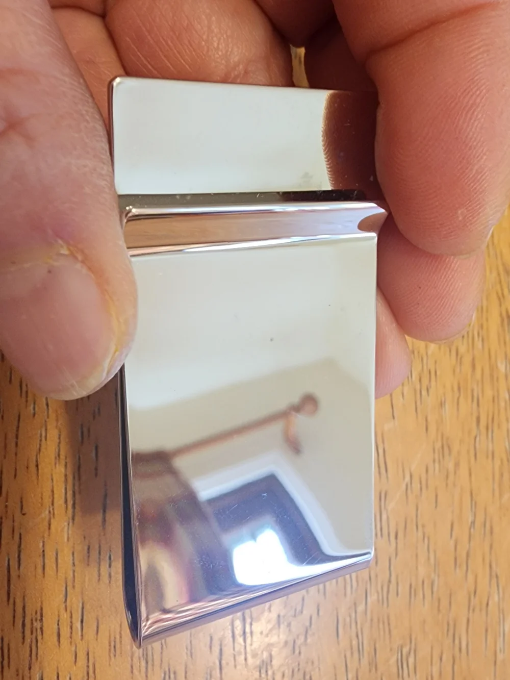 Gucci Diamante money clip featuring the signature diamond pattern and engraved